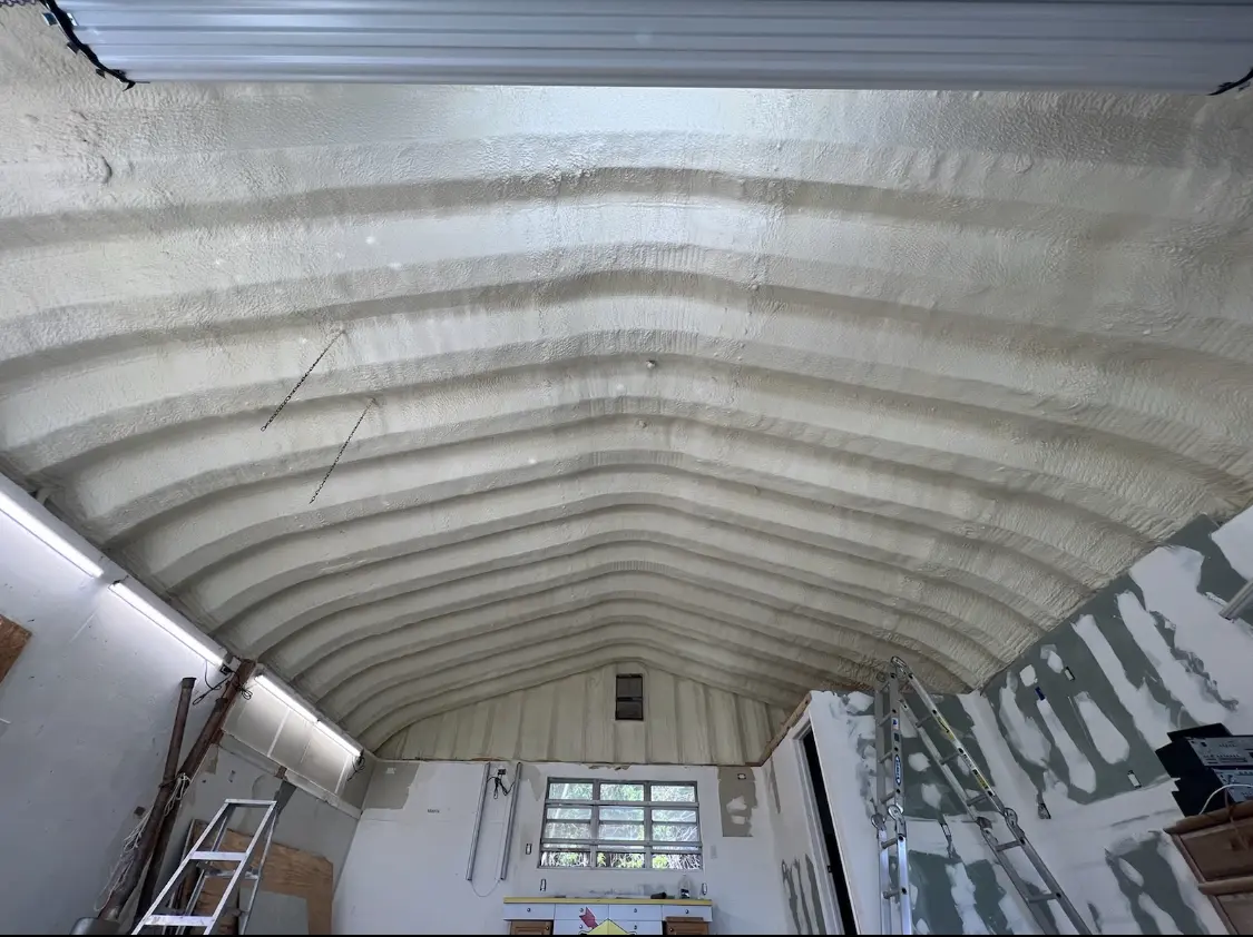 Spray polyurethane foam applied to the underside of a metal roof deck in Sunnyvale